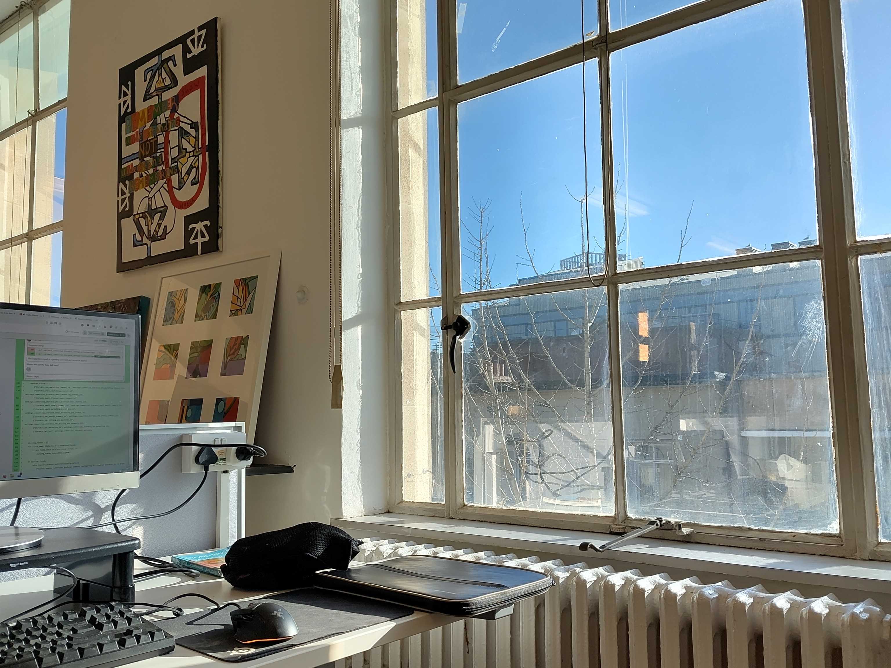 Sunlight shining through the window of Sparks on to my desk.